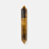 Golden Tiger eye crystal point on a white background